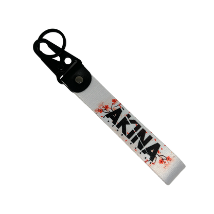 Motorev AKINA Speed Stars car key tag, a zinc alloy and nylon keyring featuring the iconic cherry blossom design, scratch resistant and built for JDM and anime car culture enthusiasts UK