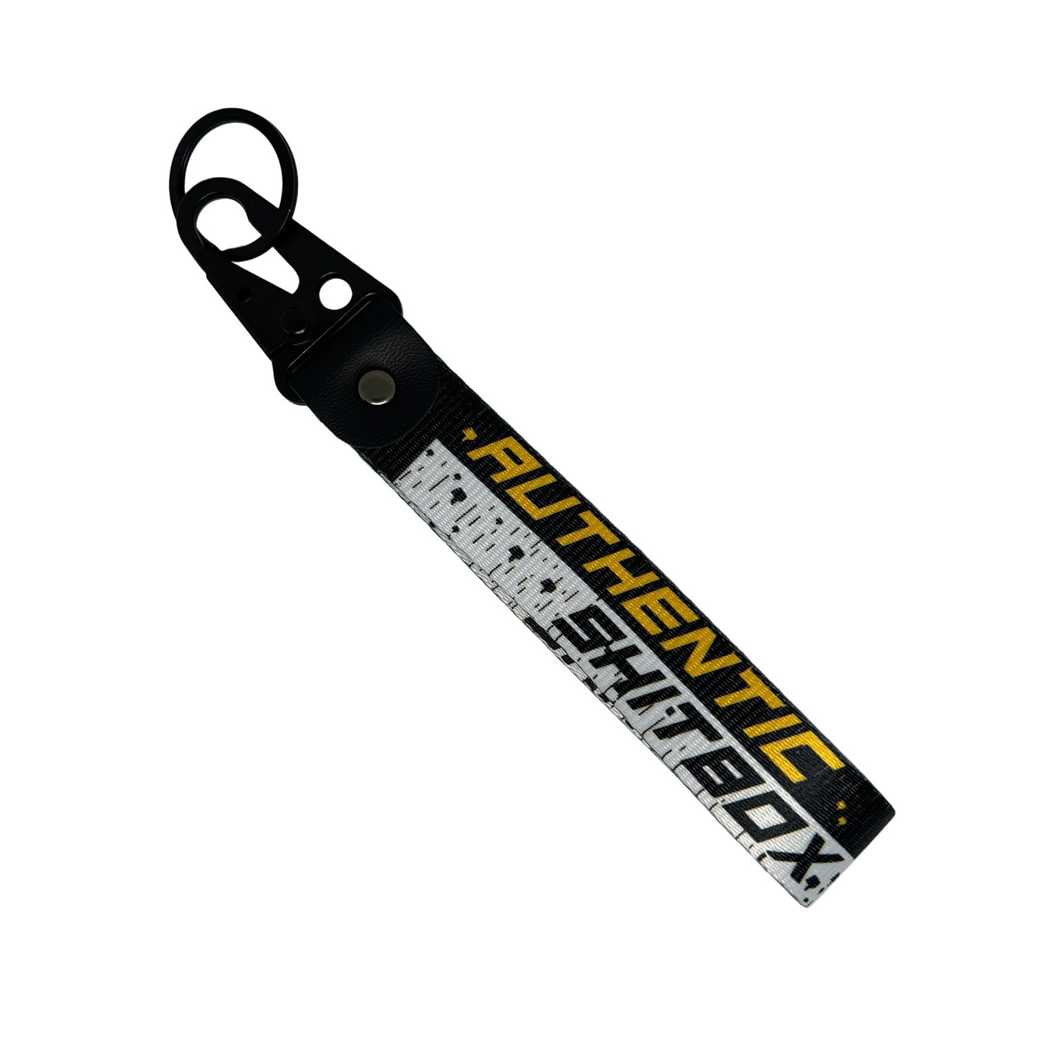 Back side of a black, white and yellow keychain with gritty design reading "Authentic Sh*tbox" – Motorev automotive keychain accessory