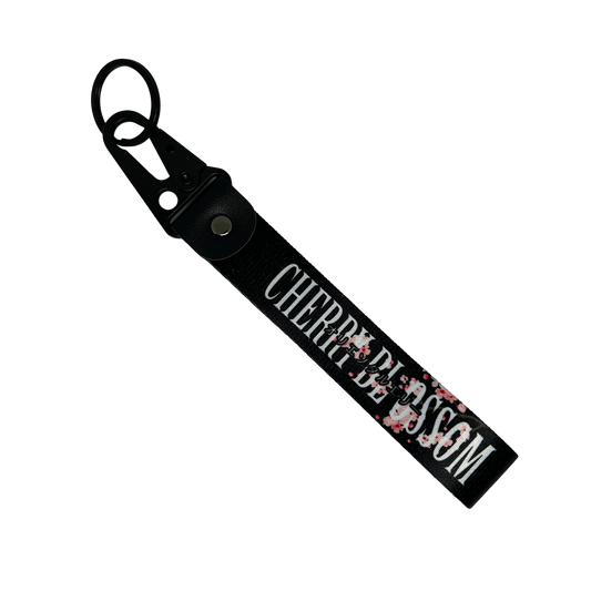 Black key tag with a floral cherry blossom design and cherry clossom in text – Motorev car accessory