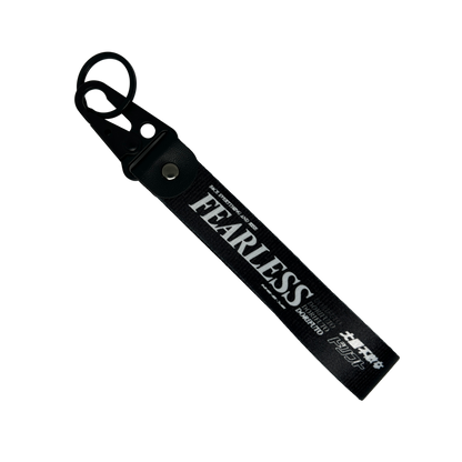 Black Fearless key tag with white text and drift design – Motorev JDM car keychain accessory