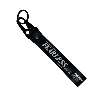 Black Fearless key tag with white text and drift design – Motorev JDM car keychain accessory