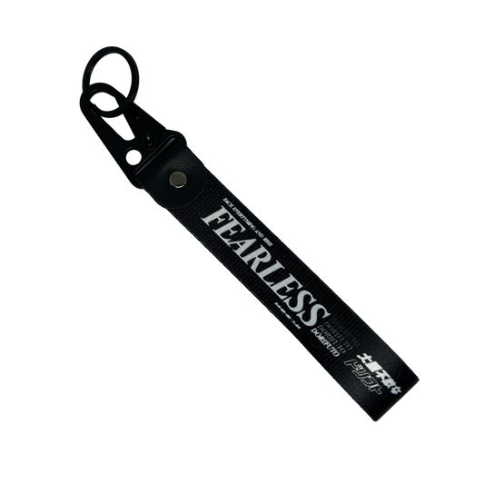 Black Fearless key tag with white text and drift design – Motorev JDM car keychain accessory