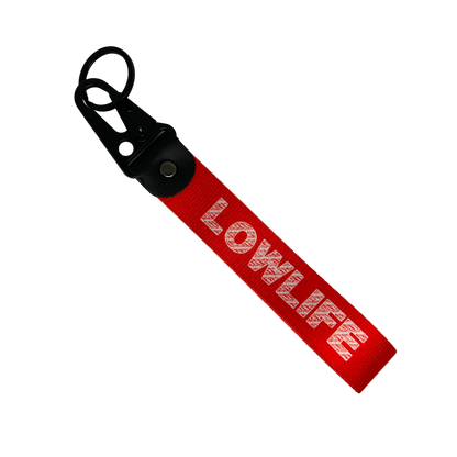 Red LOWLIFE key tag with bold street-style text – Motorev JDM car keychain accessory