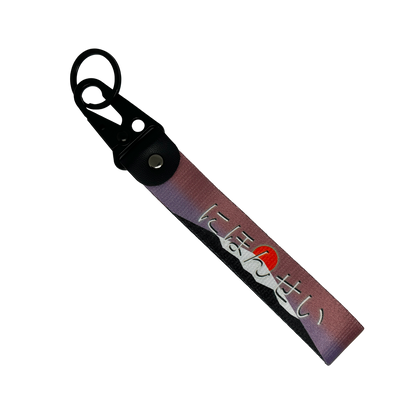JDM key tag with an image of a mount fuji sunrise and Japanese text – Motorev performance car keychain