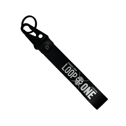 Black key tag featuring "Osaka JDM" and "Loop One" text – Motorev embroidered car keychain