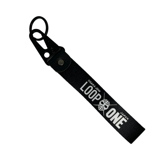 Black key tag featuring "Osaka JDM" and "Loop One" text – Motorev embroidered car keychain
