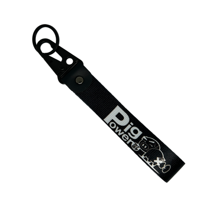 Back side of black JDM key tag with Pig Power branding – MotoRev automotive keychain accessory