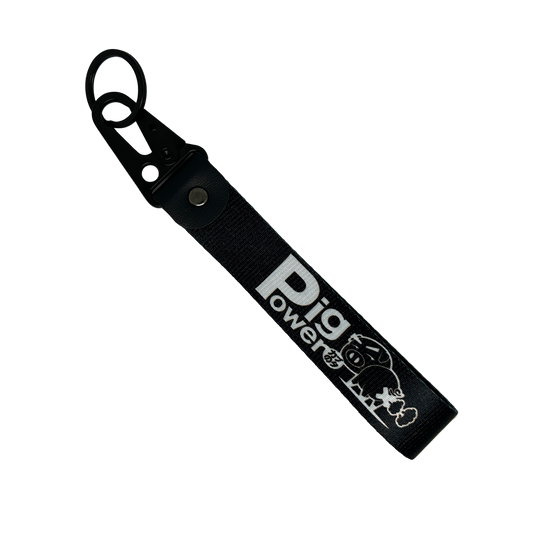 Front side of black JDM key tag with Pig Power branding – MotoRev automotive keychain accessory