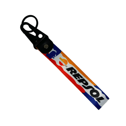 Motorev Repsol car key tag, a zinc alloy and nylon keyring featuring the iconic Repsol motorsport livery design, scratch resistant and built for motorsport and racing enthusiasts UK