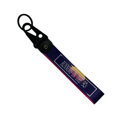 Purple key tag with a 90's sunset aesthetic and text that reads "Running In The 90's" – Motorev performance car keychain
