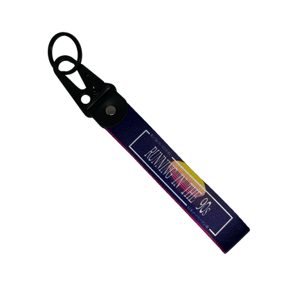 Purple key tag with a 90's sunset aesthetic and text that reads "Running In The 90's" – Motorev performance car keychain