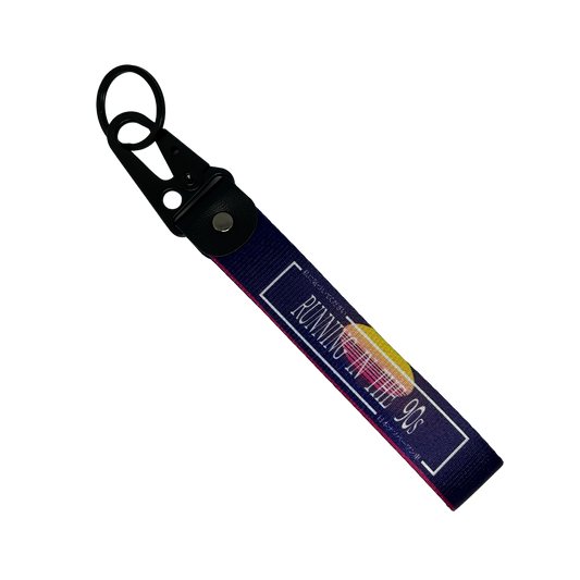 Purple key tag with a 90's sunset aesthetic and text that reads "Running In The 90's" – Motorev performance car keychain