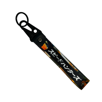 Key tag with a background image of a car scene and Japanese text reading "Speedhunters" – Motorev performance car keychain