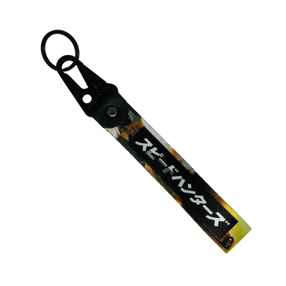 Key tag with a background image of a car scene and Japanese text reading "Speedhunters" – Motorev performance car keychain