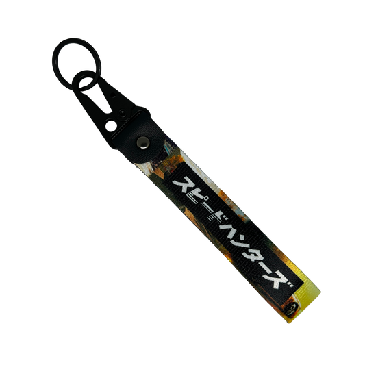 Key tag with a background image of a car scene and Japanese text reading "Speedhunters" – Motorev performance car keychain