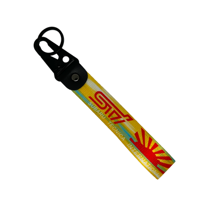 Yellow key tag with the Subaru WRX STI logo and Japanese rising sun – Motorev automotive keychain