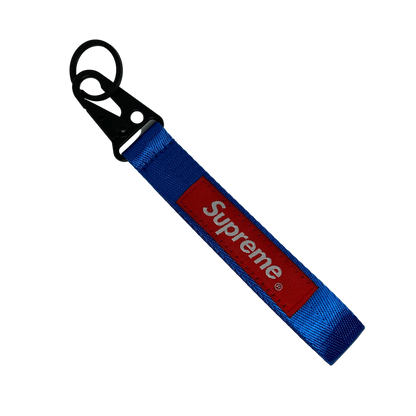 Blue Supreme style key tag with bold logo text – Motorev JDM car keychain accessory